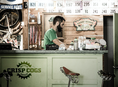 Man behind a bike counter